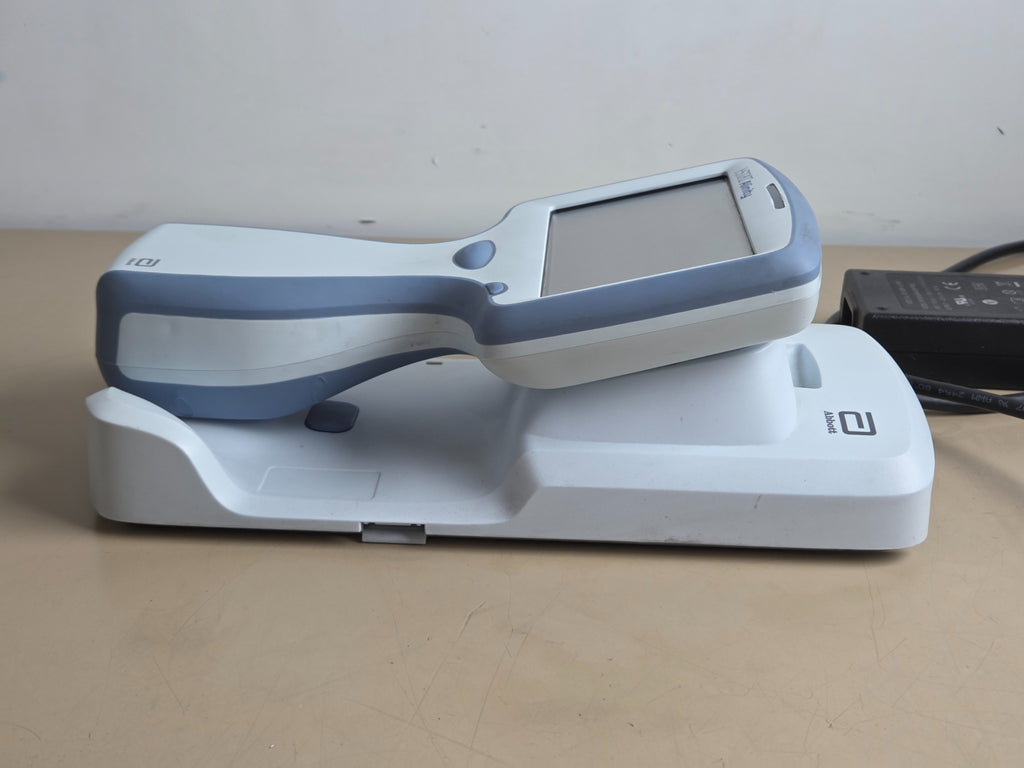 Abbott i-STAT Alinity handheld analyzer side view on base station