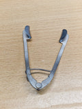 Rear view of adjustable ophthalmic eye speculum showing solid eyelid blades and spring mechanism