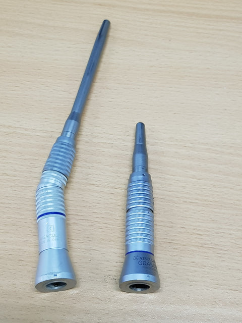 Close-up of two Aesculap handpiece attachments
