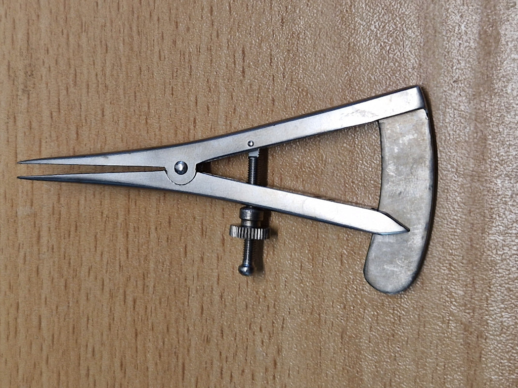 Castroviejo ophthalmic surgical caliper with straight pointed tips and engraved measuring scale