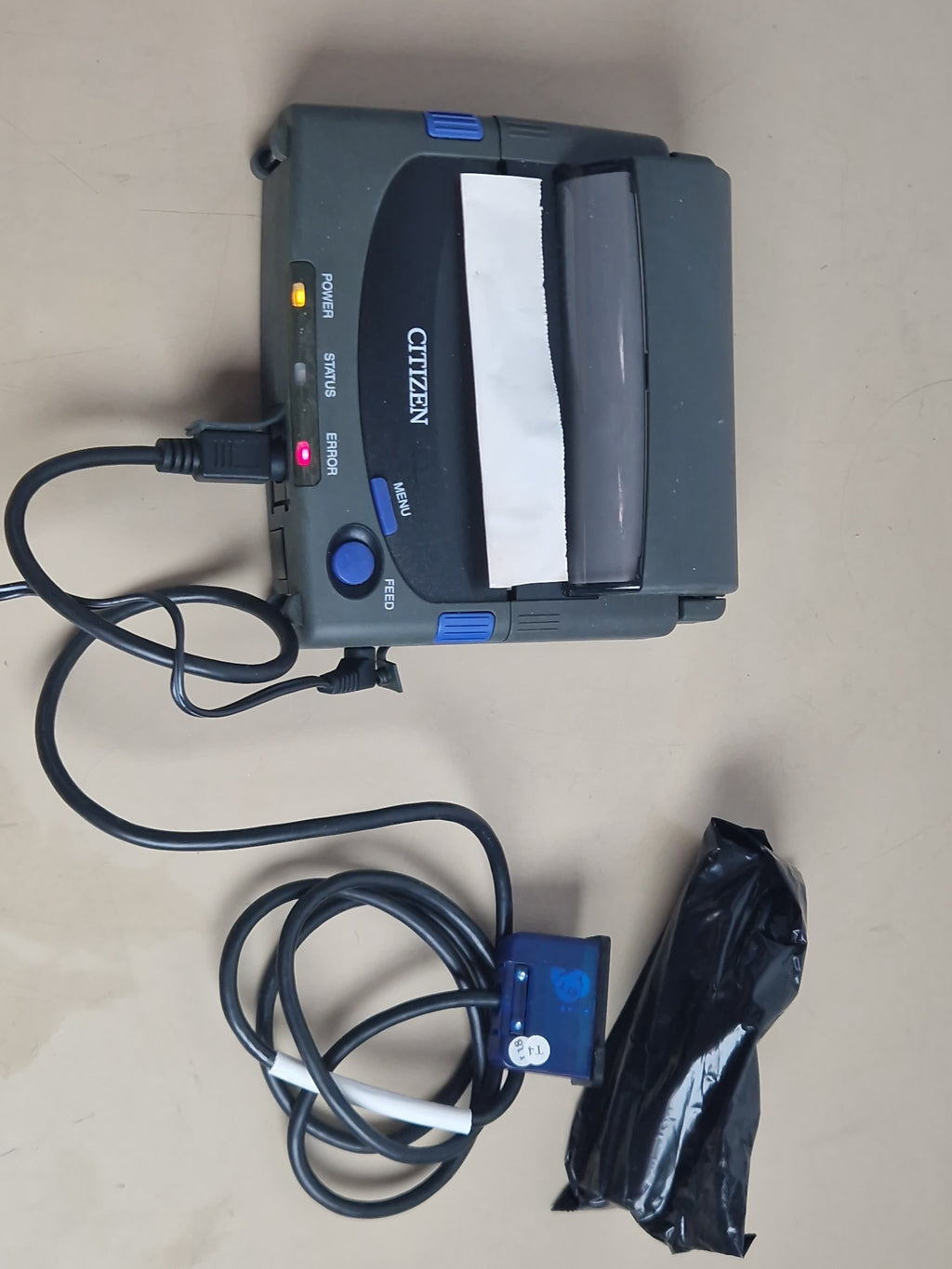 Citizen PD-24 printer powered on with interface cable and accessories