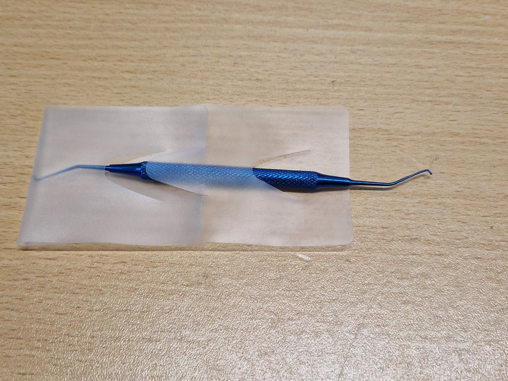 Used blue titanium double-ended Sinskey-type ophthalmic hook with regular and reverse angled tips