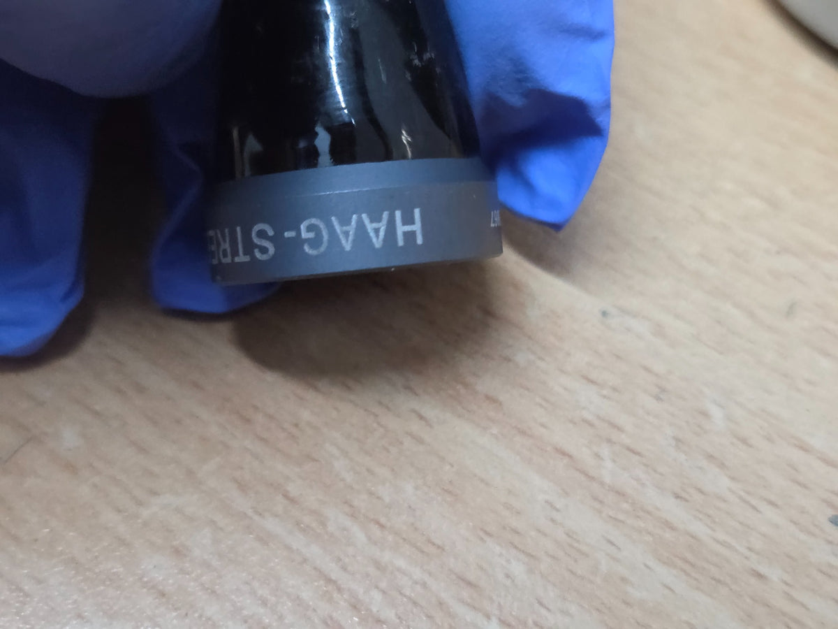 Haag-Streit CGIL iridectomy contact lens and storage container