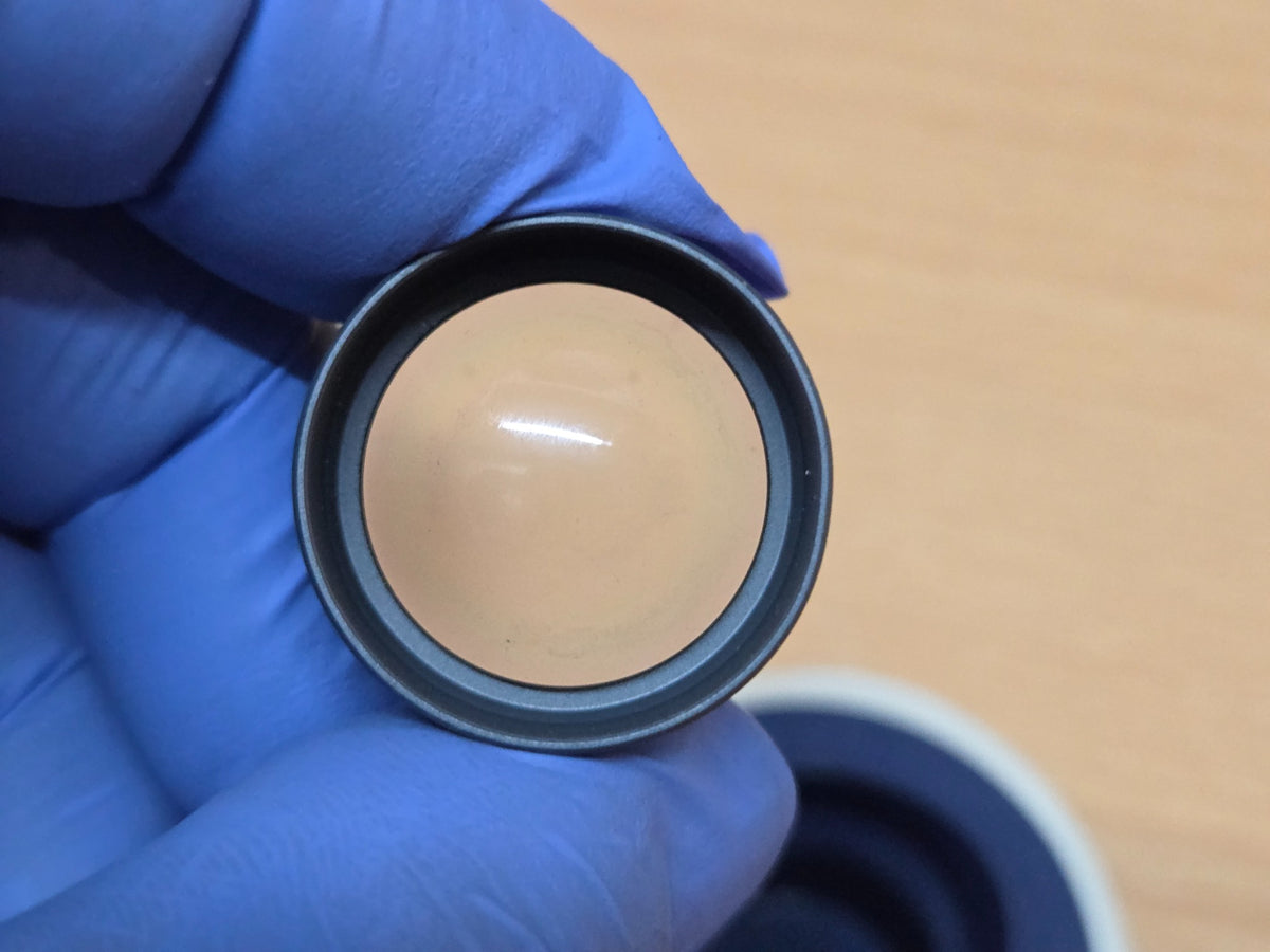 Haag-Streit CGIL iridectomy contact lens and storage container