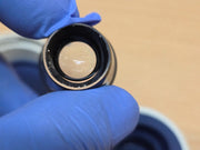 Haag-Streit CGIL iridectomy contact lens and storage container