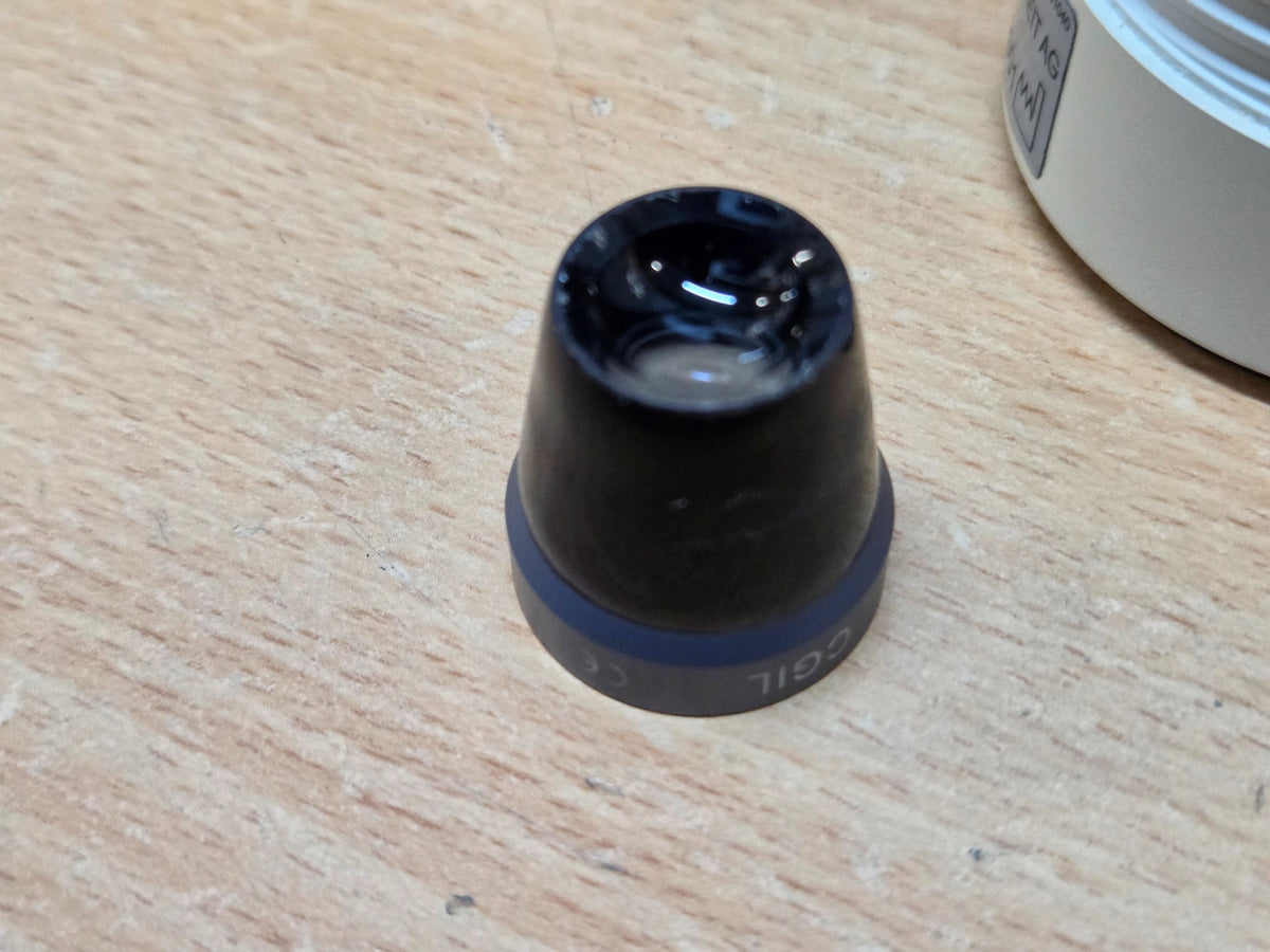 Haag-Streit CGIL iridectomy contact lens and storage container