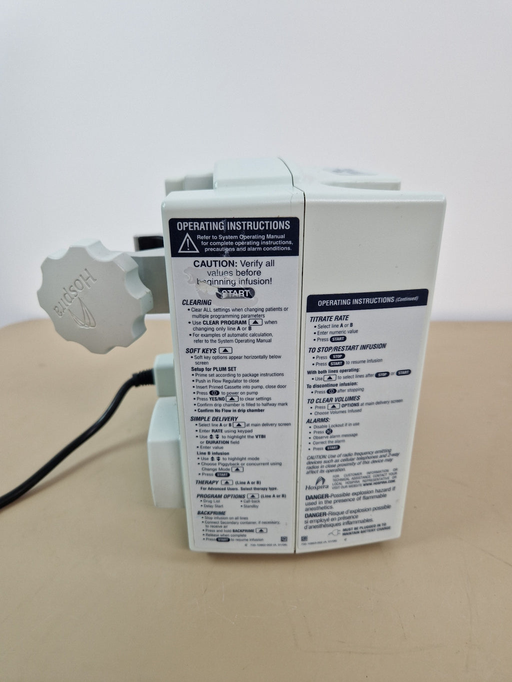 Hospira Plum A+ infusion pump side panel with operating instructions