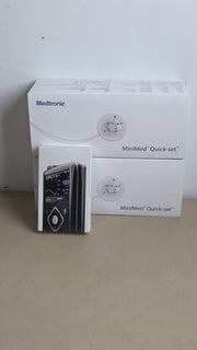 Medtronic MiniMed insulin pump packaging and Quick-set MMT-399A boxes