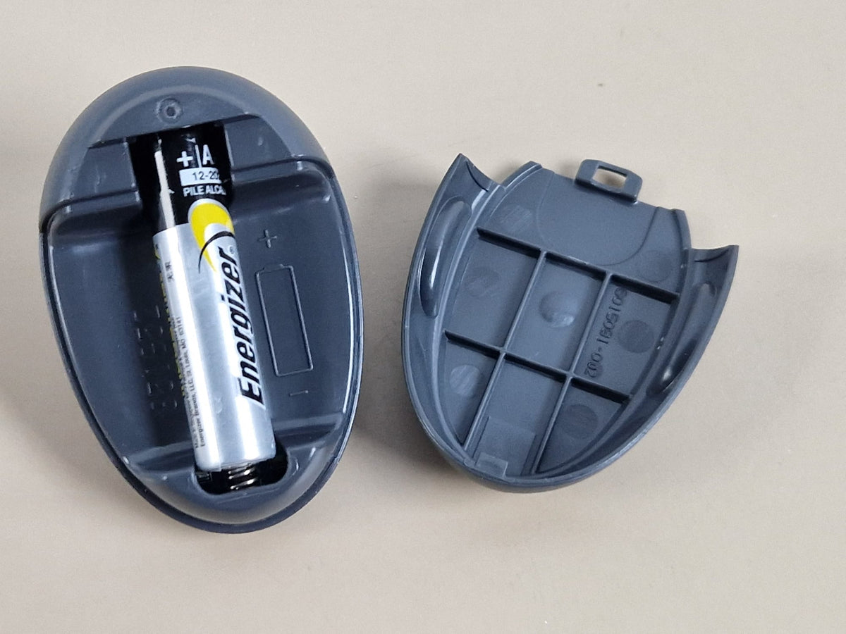 Medtronic MMT-7715 charger — AAA battery compartment and removable cover