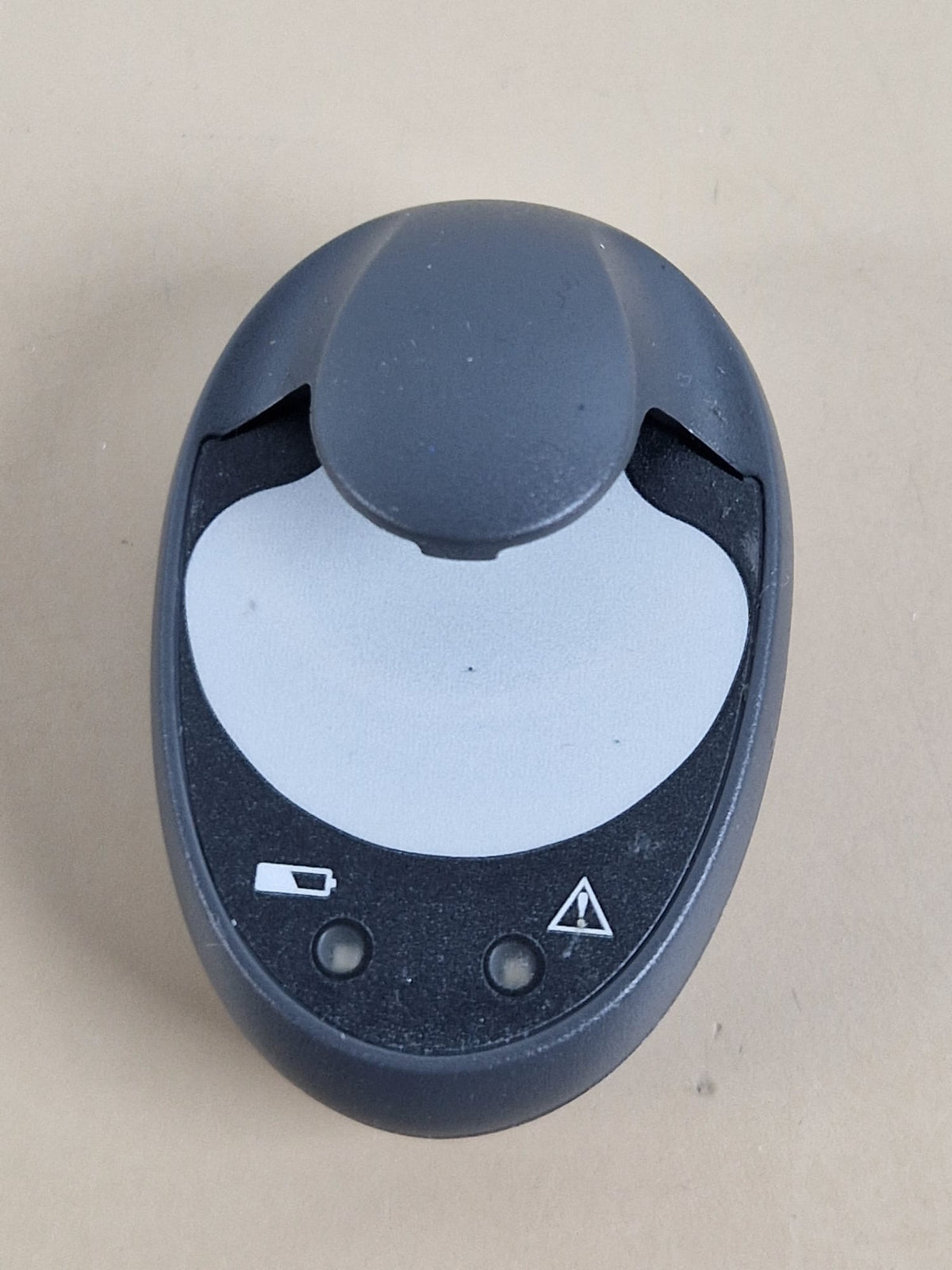 Medtronic MMT-7715 used charger front view — charger only; transmitter not included