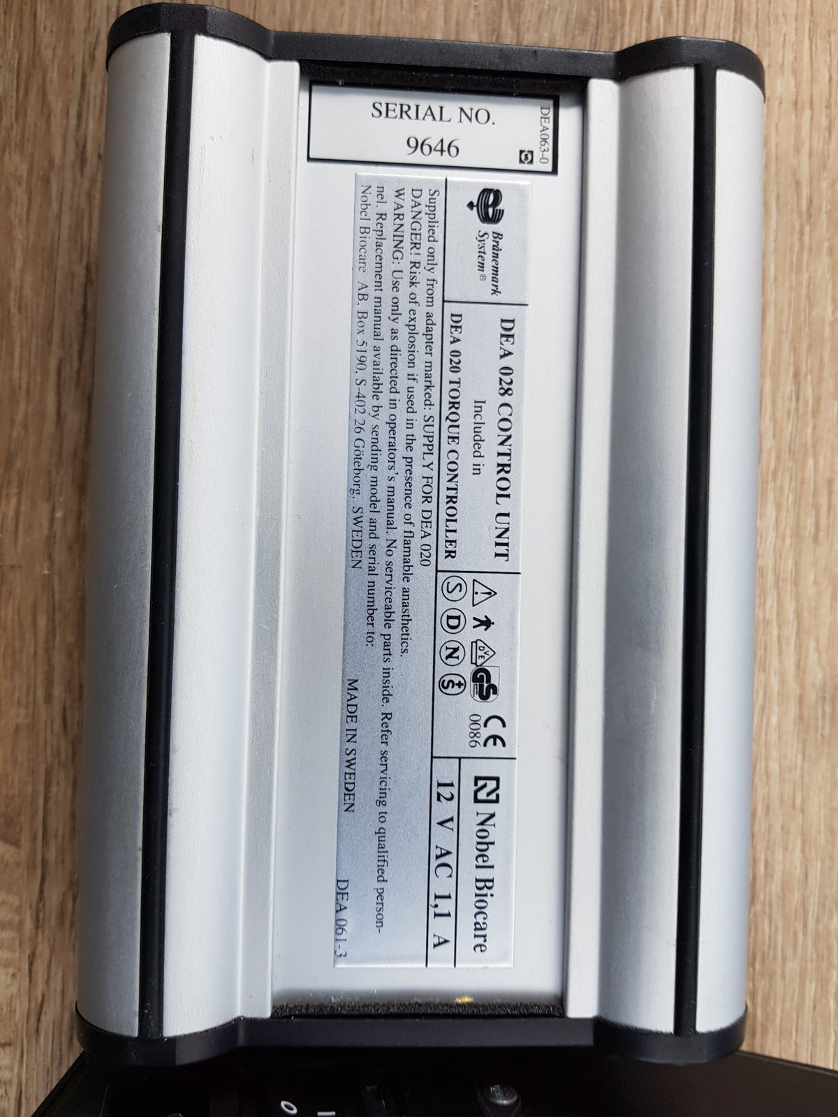 Close-up of Nobel Biocare DEA 028 control unit and DEA 020 torque controller label
