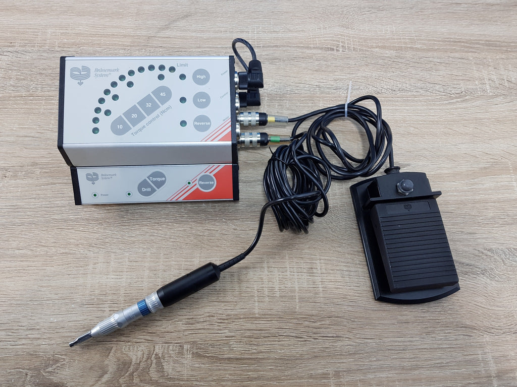 Nobel Biocare Branemark torque controller and drill controller powered on with handpiece and footswitch