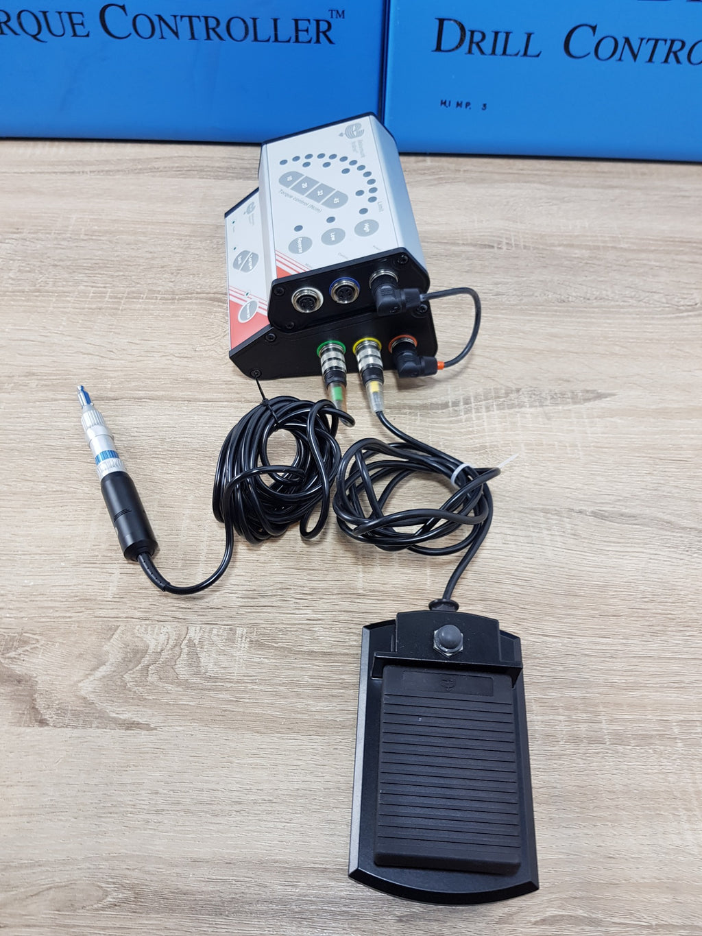 Rear connector view of Nobel Biocare Branemark drill and torque controllers with motor and foot control cables