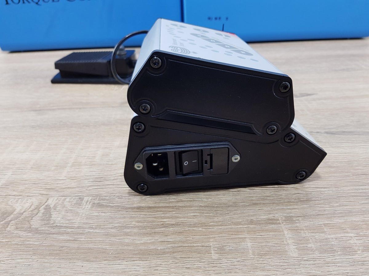 Top view of Nobel Biocare Branemark DEA 028 torque control unit and drill controller with foot pedal and motor