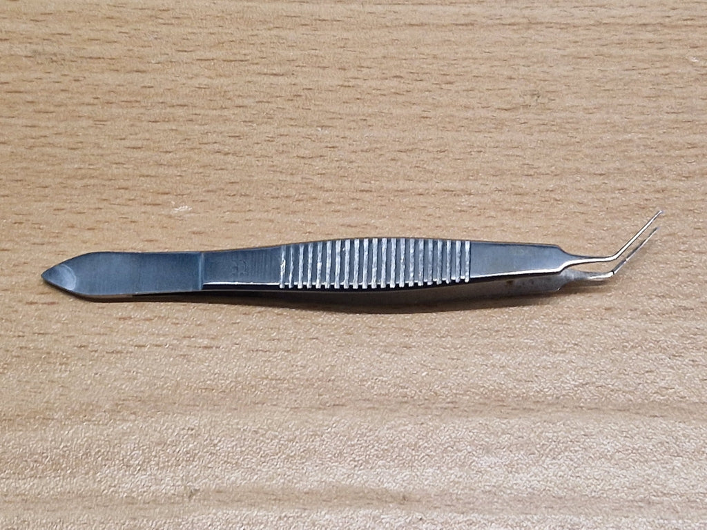 Used ophthalmic angled tying forceps side view with fine microsurgical tips