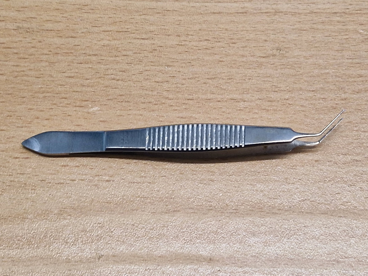 Used ophthalmic angled tying forceps side view with fine microsurgical tips