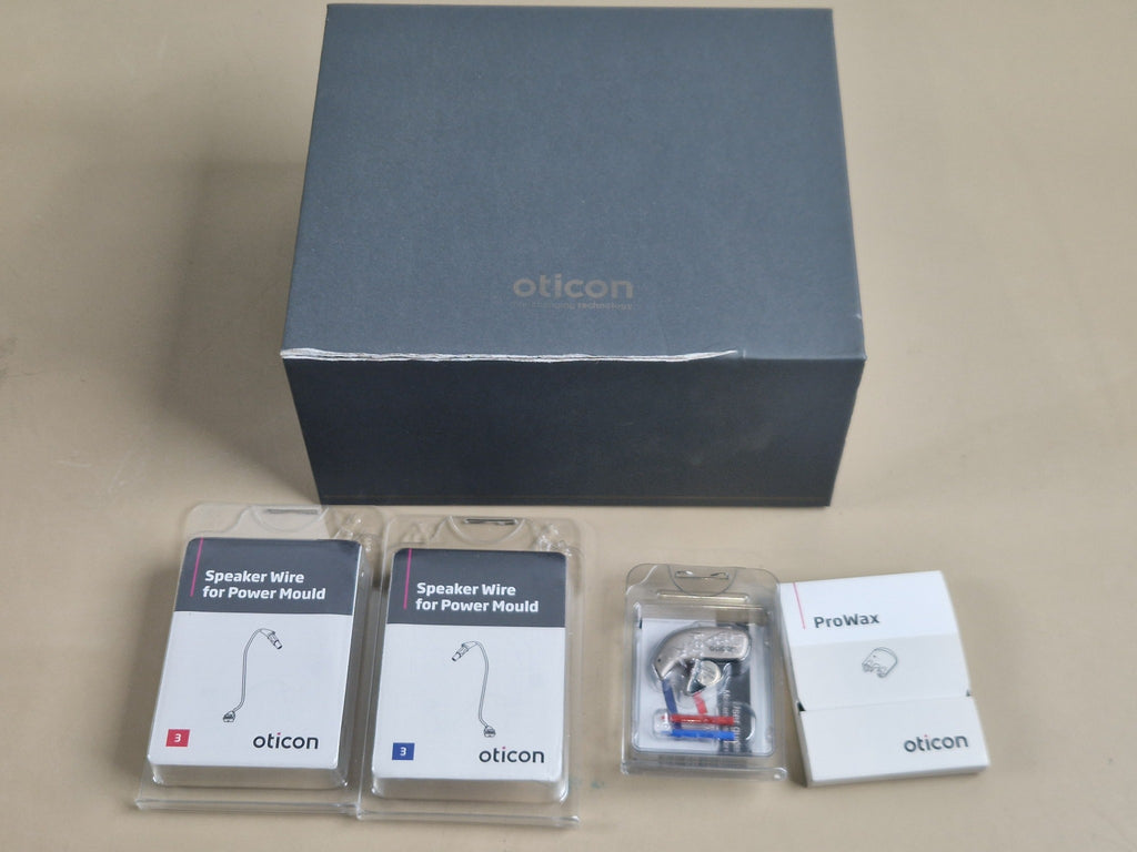 Oticon Real 2 hearing aid set with original box speaker wires and ProWax accessories