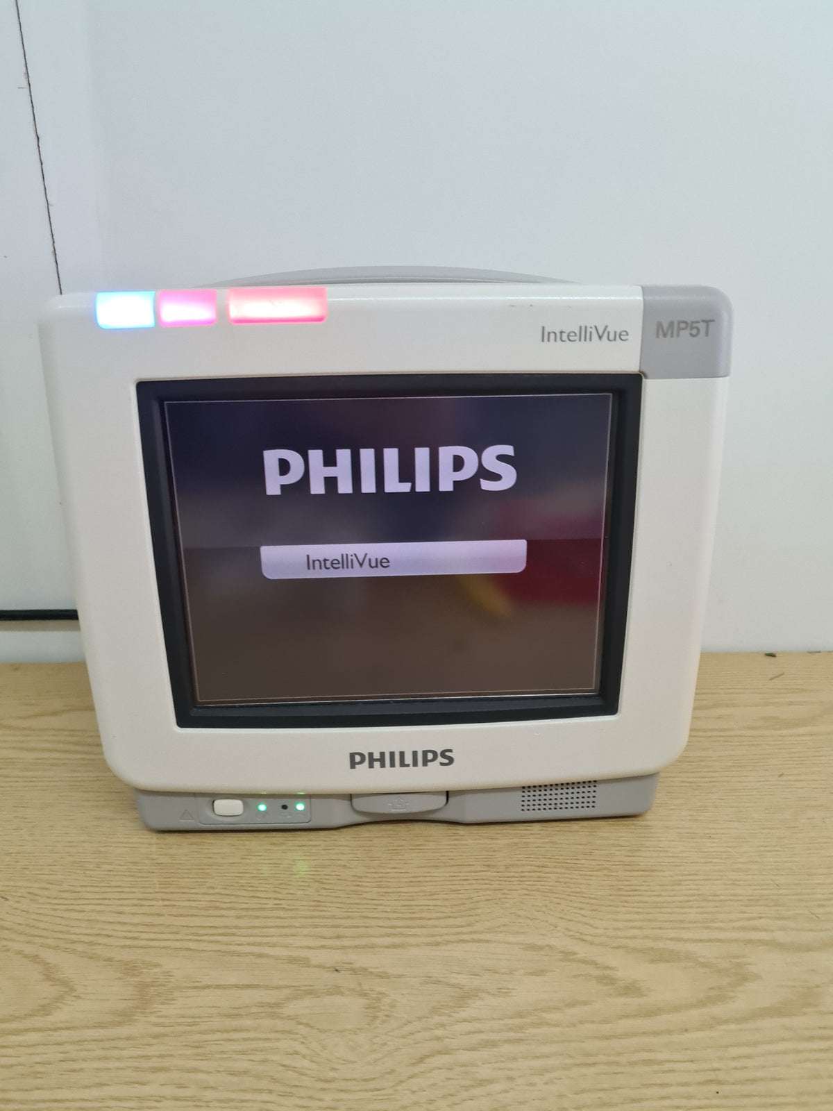 Philips IntelliVue MP5T M8105AT patient monitor powered on front view