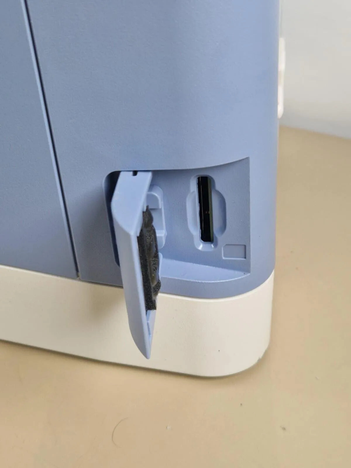 Philips Respironics Trilogy 202 ventilator side access panel detail