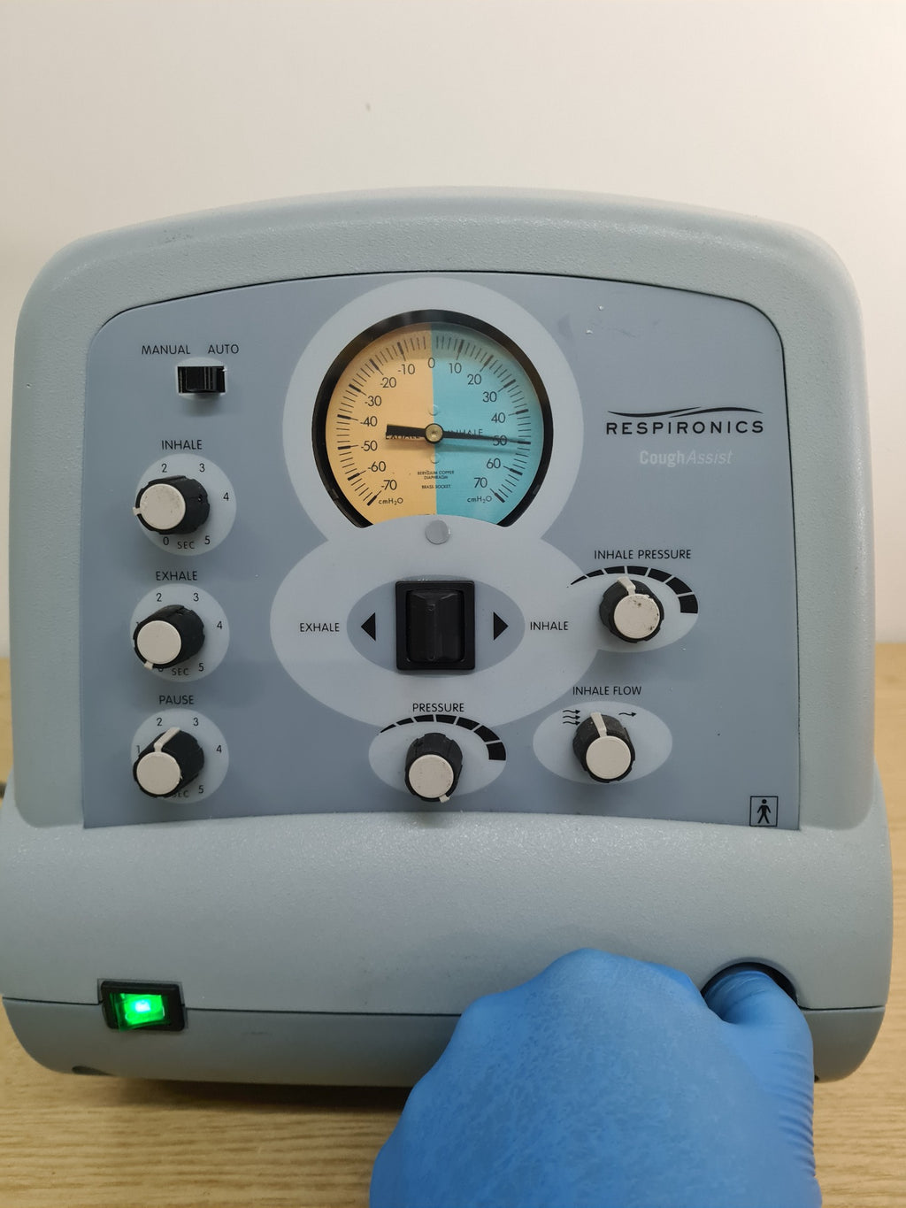 Respironics CoughAssist CA-3200 powered on showing pressure gauge