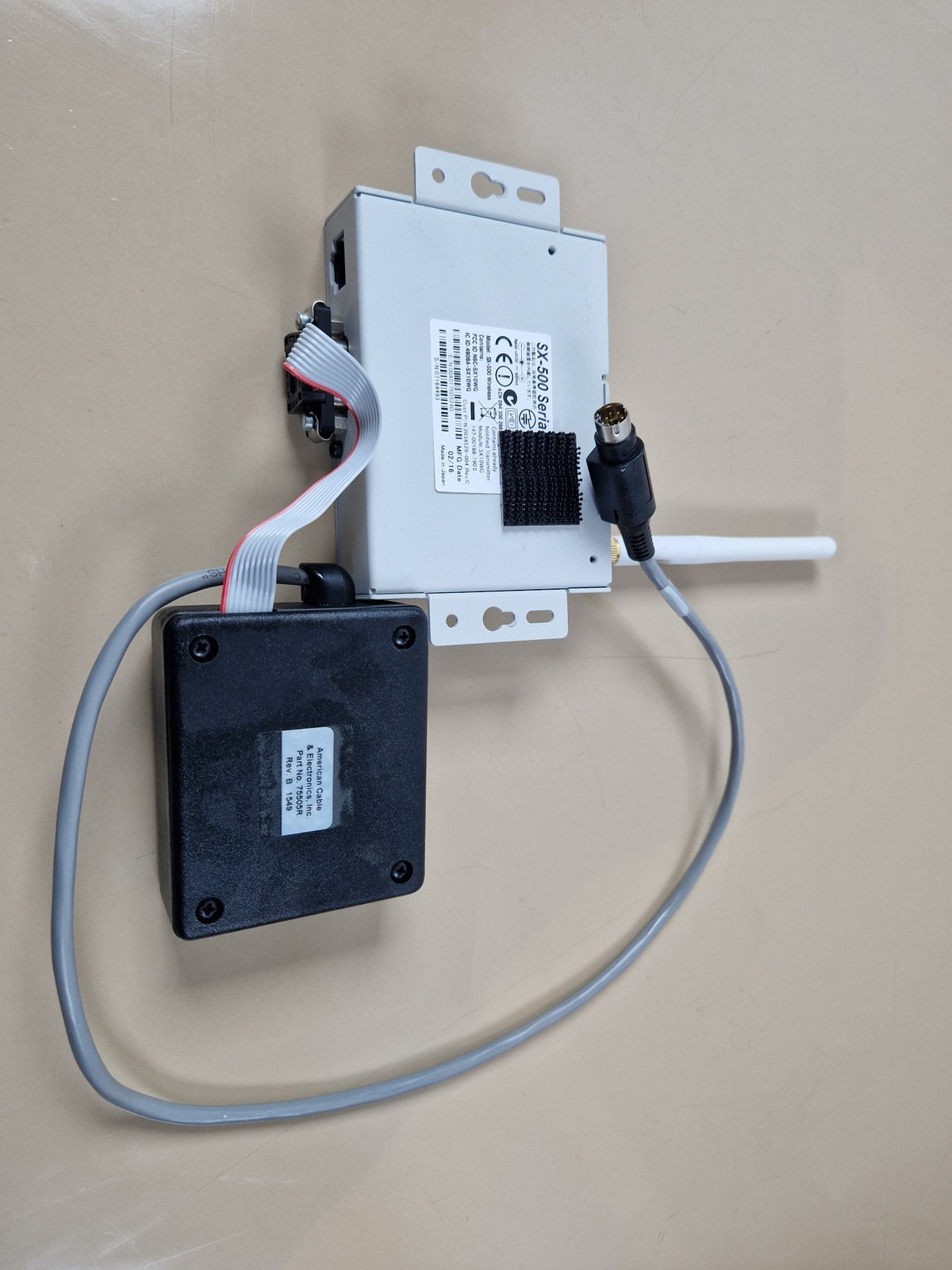 Silex SX-500 wireless serial device server rear view with interface module and cable