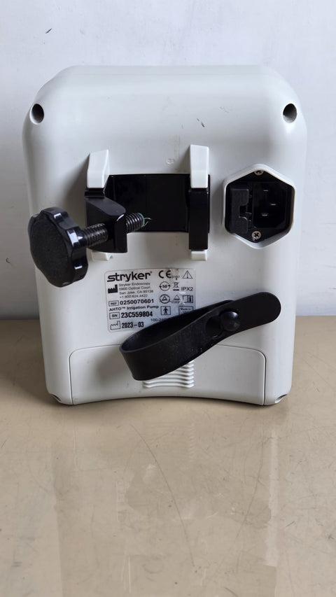 Stryker AHTO irrigation pump REF 0250070601 — rear label and clamp