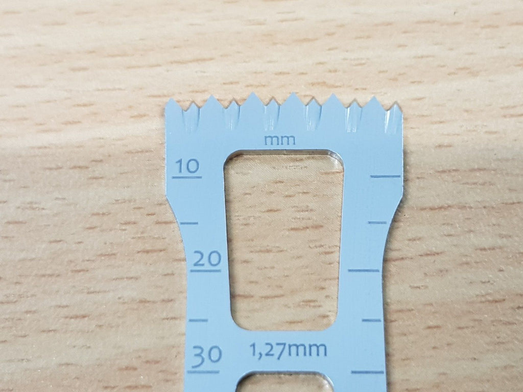 Stryker saw blade showing 10 20 30 mm markings and 1.27 mm marking