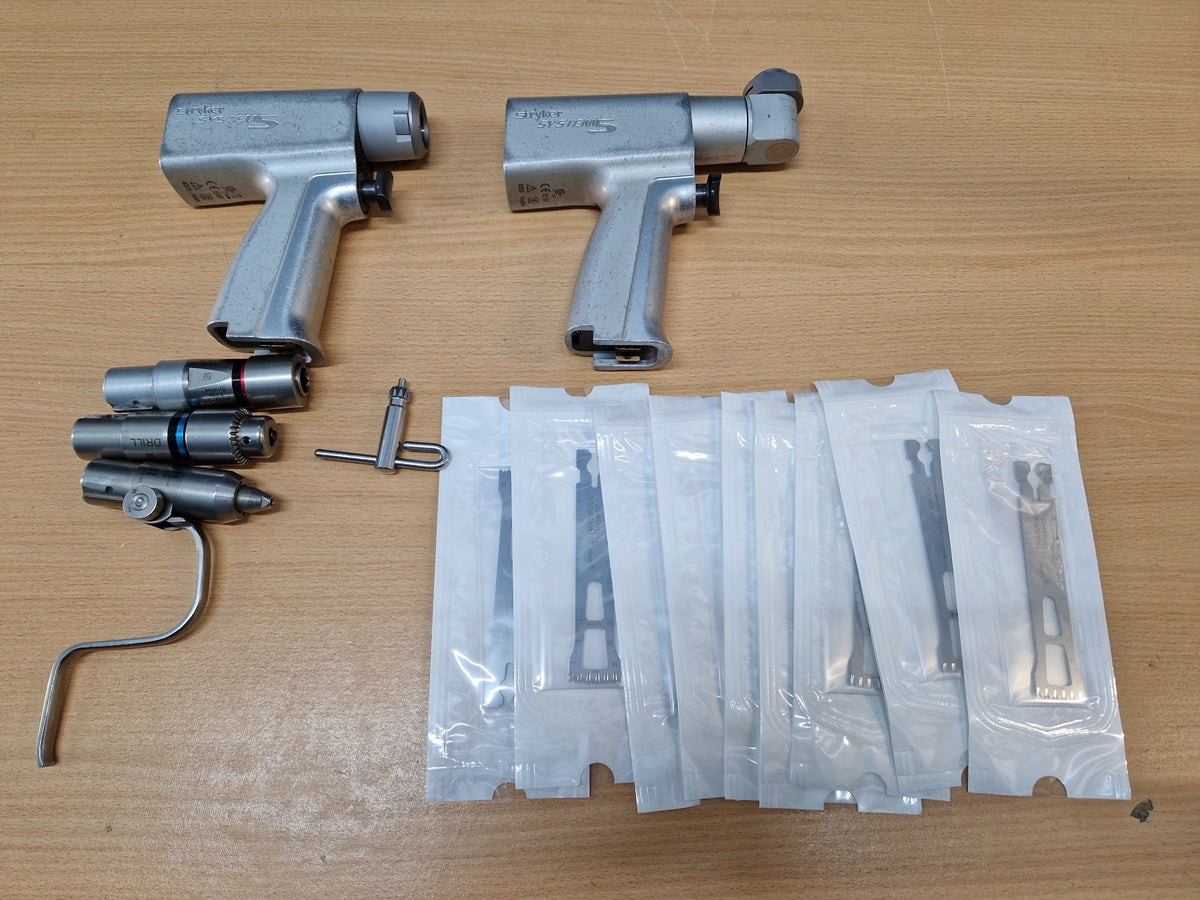 Stryker System 5 orthopaedic power tool set with handpieces, drill and reamer attachments, key and blades