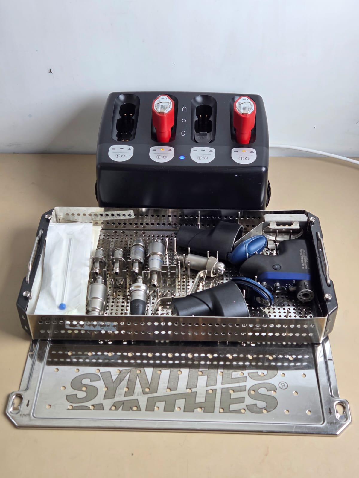 Synthes Colibri surgical drill set in sterilization tray with Universal Battery Charger II