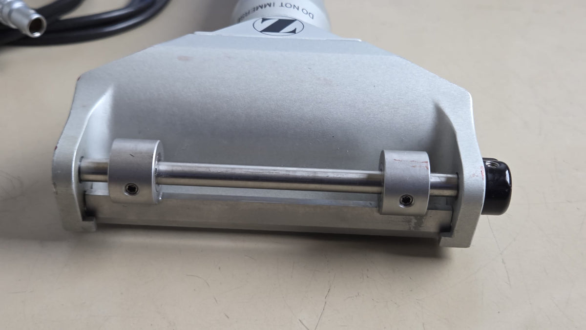 Close-up of Zimmer electric dermatome head and adjustable front assembly showing cosmetic wear